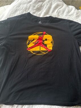 Jordan Black Short Sleeve Tee with Red Jumpman and Yellow Graphic